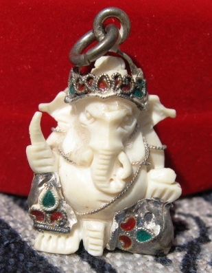 carved antique ivory Ganesha with enameled silver