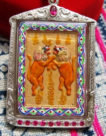 Kruba Kritsana framed with Pair of Lions with chain